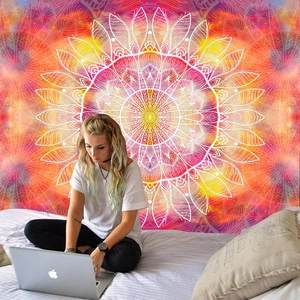 Detail of bohemian mandala wall tapestry with gradient colors in a bedroom setting