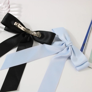 Satin bow hair clip set in black and light blue with metal spring clip attachment