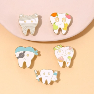 Set of 5 cartoon tooth enamel pins including mummy and pirate themes for medical gifts