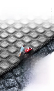 Macro shot of waterproof PVC non-slip backing with grid texture and water droplets