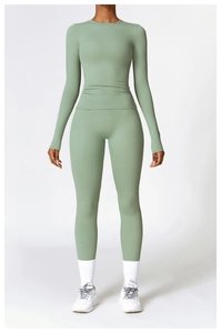 Front view of grey-green long sleeve yoga top and high-waist leggings set for workout