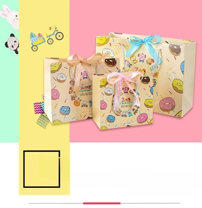Detailed view of cartoon animal gift bags with colorful donuts and ribbon bow handles