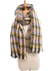 Detail of thick plaid knit scarf featuring tassels in pink, yellow and brown tones