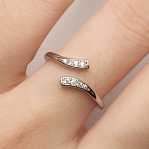 Silver open ring with cubic zirconia stones and minimalist adjustable band for women