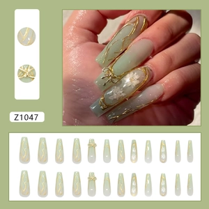 Green press-on nails with 3D white daisy and golden bow knot designs in 24pcs set