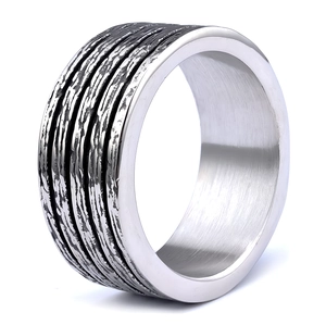 Macro detail of textured bark pattern on silver unisex wide stainless steel ring band
