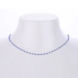 Elegant S925 sterling silver necklace with blue beads shown on a model neck