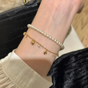 Elegant gold heart pendant bracelet and white pearl layering set for women's jewelry