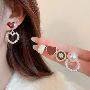 Elegant geometric pearl and diamond stud earring set with heart patterns for women