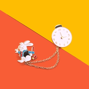 Detail of Alice in Wonderland style rabbit and clock brooch with gold link chain