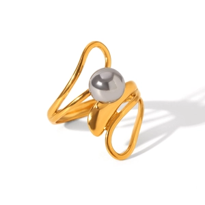 Detail view of a golden irregular line ring featuring a centered grey spherical bead