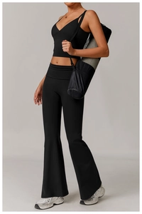 Detail of black V-neck sports vest and high-waist yoga pants with a matte finish texture