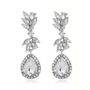 Elegant silver teardrop bridal earrings with luxury crystal stones on white background