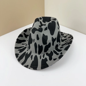 Stylish vintage cow print felt cowboy hat featuring western aesthetic for women