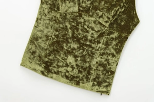 Macro shot of olive green crushed velvet fabric texture and stitching details on top