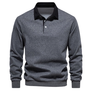 Detail of dark grey polo sweatshirt featuring black contrast collar and button placket