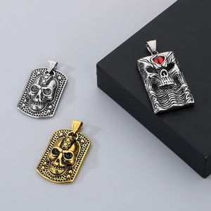 Detailed view of gothic skull pendants with red demon eye and vintage metallic textures