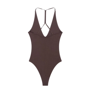 Detailed flat lay of dark brown ribbed bodysuit with cross-strap back on white background