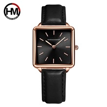 Detail view of square black dial and rose gold case on Hannah Martin watch