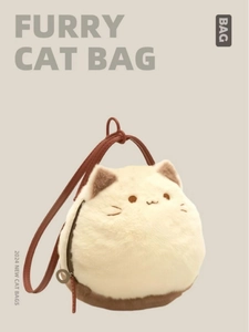 Detail of furry cat bag with cream plush texture and brown leather shoulder strap