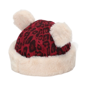 Detail of winter leopard print baby hat featuring plush cream faux fur balls and warm lining