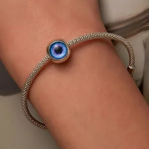 Handcrafted sterling silver mesh bracelet with a blue mystic evil eye bead centerpiece