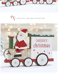 Close-up of wooden Christmas train decor with Santa Claus and festive red patterns