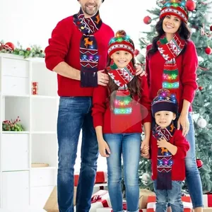 Family wearing matching LED Christmas knitted hats and scarves with reindeer patterns