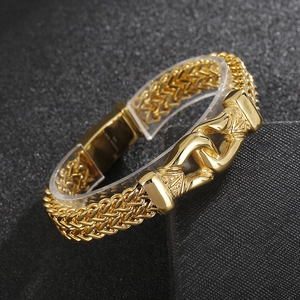 Macro view of gold-tone titanium steel double keel chain bracelet with a secure clasp