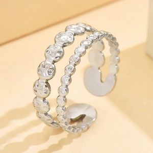 Double-layered vintage silver coin ring with crater texture in stainless steel