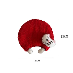 Detailed view of handmade red wool felt cat coaster showing 13cm size specifications