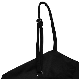 Detail of adjustable metal buckle and strap on a black V-neck ruched dress