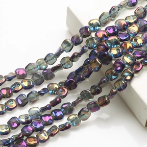 Detail of 12mm iridescent purple and blue glass beads with a rhombus-shaped hole