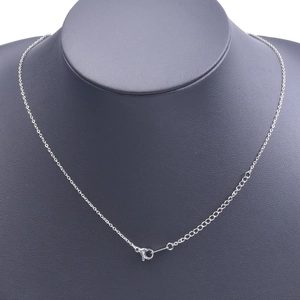 Detailed view of a silver stainless steel chain necklace on a mannequin with lobster clasp