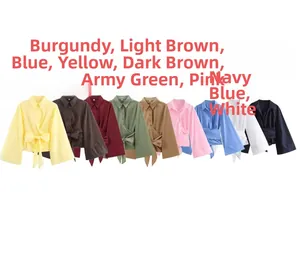 Détail de chemises à manches longues avec nœuds à l'avant en neuf coloris variés