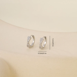 Detail of silver cubic zirconia earrings with size dimensions 1.2cm height and 0.3cm width