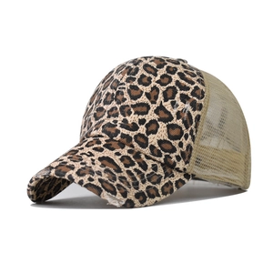 Detail of leopard print baseball cap featuring breathable mesh back and distressed brim