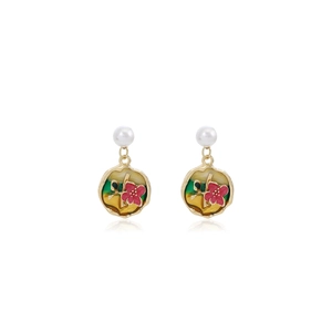 Detailed view of floral enamel pendant earrings with pearl accents and gold-plated finish