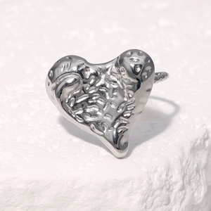 Polished stainless steel heart ring with textured lava hammered finish in silver tone