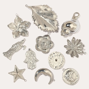 Polished silver stainless steel charms featuring leaf, moon, and star shapes for DIY jewelry