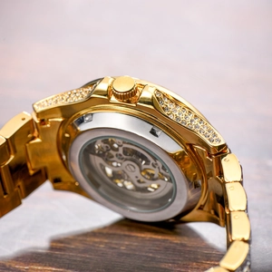 Gold luxury automatic skeleton mechanical watch with diamond-set case and metal strap