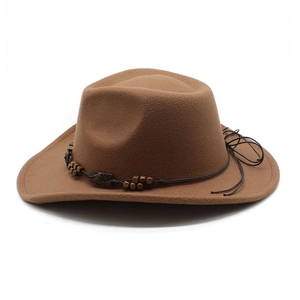 Detailed view of a brown felt cowboy hat with dark beaded rope trim and curved brim