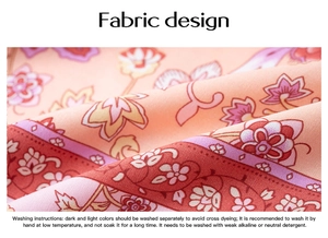 Detailed fabric texture with pink floral paisley pattern and washing instructions