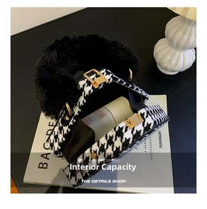 Detail view of houndstooth bag interior with plush handle and golden square lock