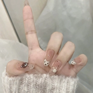 Press-on nails featuring cute brown bears, leopard patterns, and white 3D paw prints