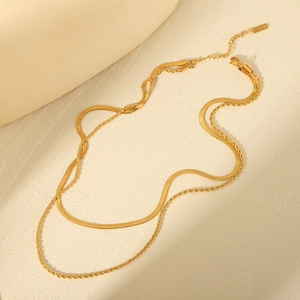 Double-layered gold stainless steel necklace featuring twist chain and flat snake chain