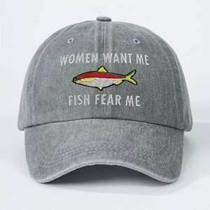 Washed grey baseball cap featuring Women Want Me Fish Fear Me embroidery and cotton texture
