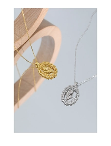 Close-up of gold and silver S925 sterling silver tulip flower oval pendant necklaces
