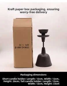 Detail of vintage cast iron candlestick with its brown cardboard packaging box