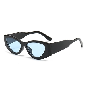 Retro punk chunky cat eye sunglasses with thick black frame and light blue tinted lenses